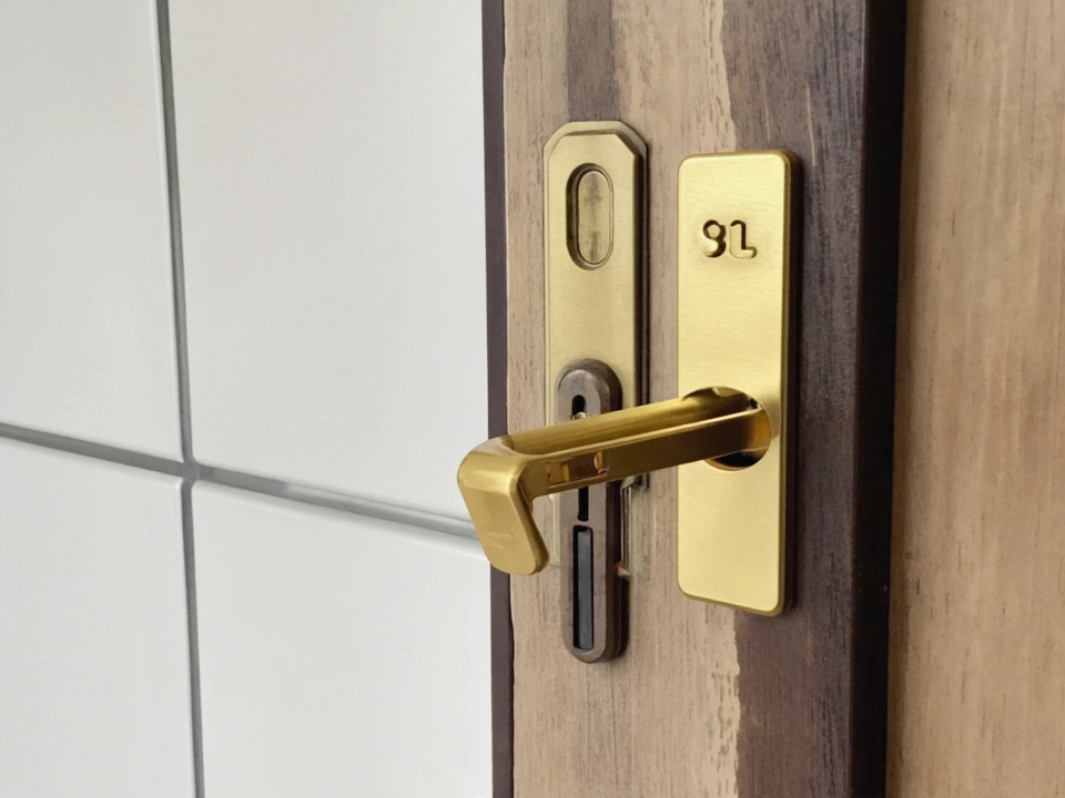 Professional locksmith installing a high-security lock system with advanced laser-cut keys in Livonia MI